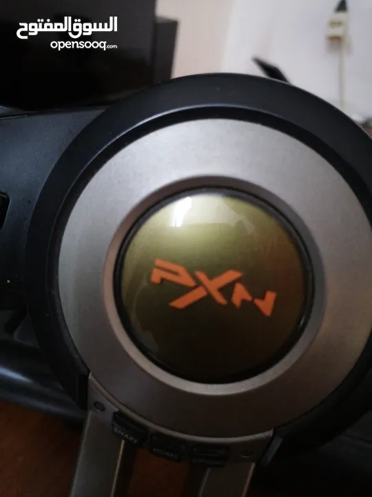 a pxn simulator pack with a steering wheel and a pedals with a gear shifter