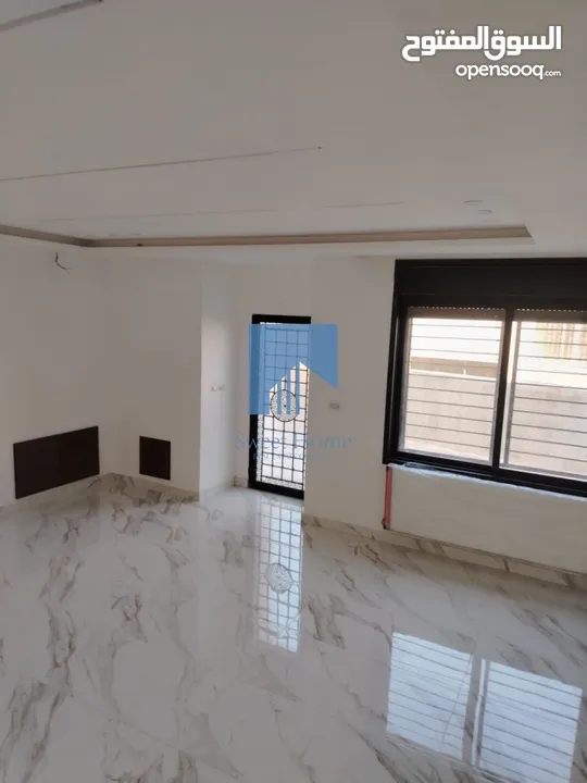 شقة أرضية فاخرة للبيع في خلدا  - خلف المستشفى السعودي 330م مع حديقة وترسات 100م لم تسكن