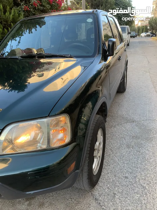 هوندا cr-v لون زيني موديل 2001 بداعي السفر