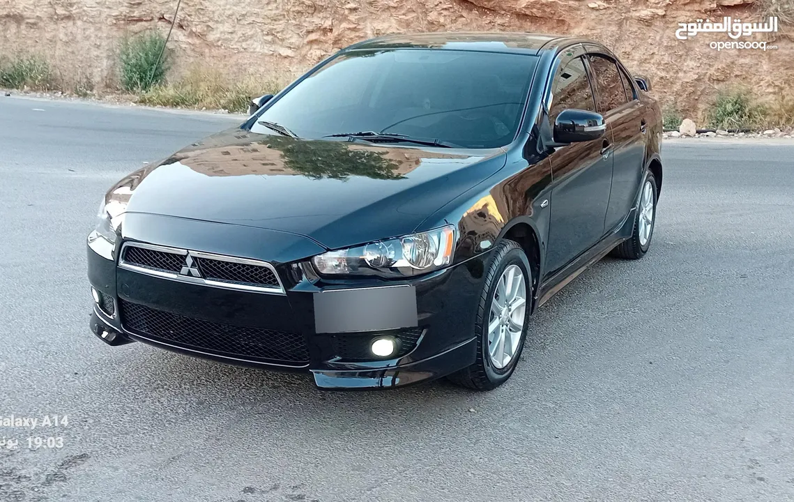 متسوبيشي لانسر فراشة موديل 2015 فحص مرفق مع الصور بحالة الوكاااااالة  ماشية 49 الف km  أصلي