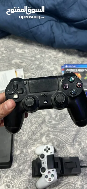 Ps4 with two controllers and 4 games including overwatxh ultimate edition