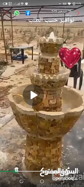 نوافير حديقه كبيره ملبسه حجر