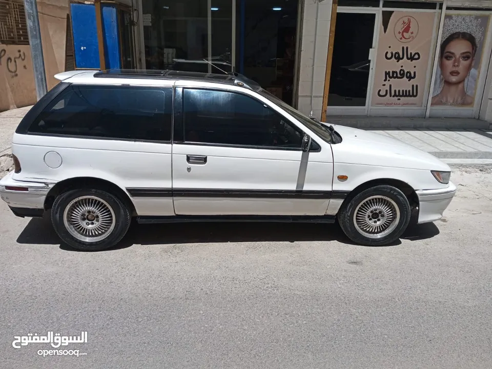 متسوبيشي ميراج 1990 ابيض باب واحد