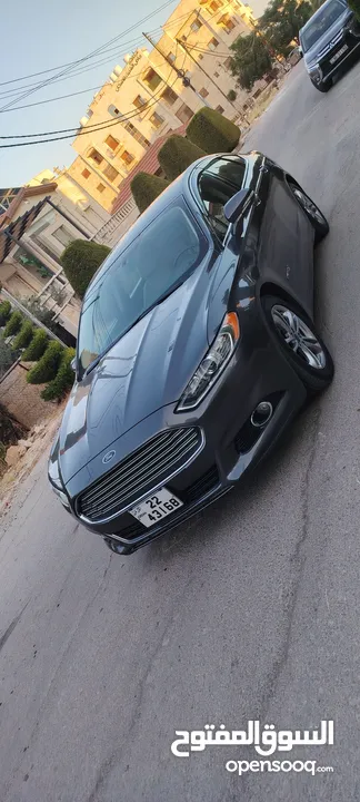 فورد فيوجن 2015 اعلى صنف تيتانيوم اصلي  بدون فتحه فحص كامل 7جيد