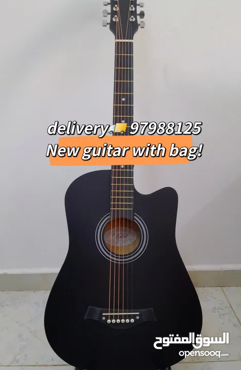 New acoustic guitar, with bag and picks, delivery