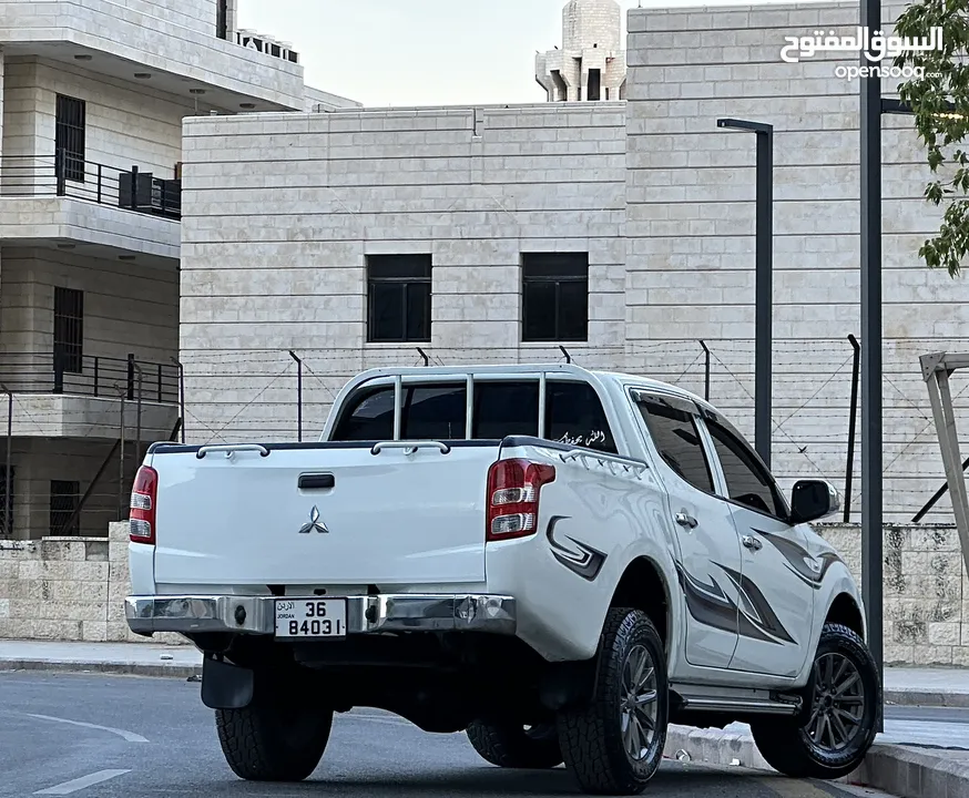 ميتسوبيشي L200 2016 لون ابيض مميزه فحص كامل كرت ابيض 7 جيد دفع رباعي 4x4