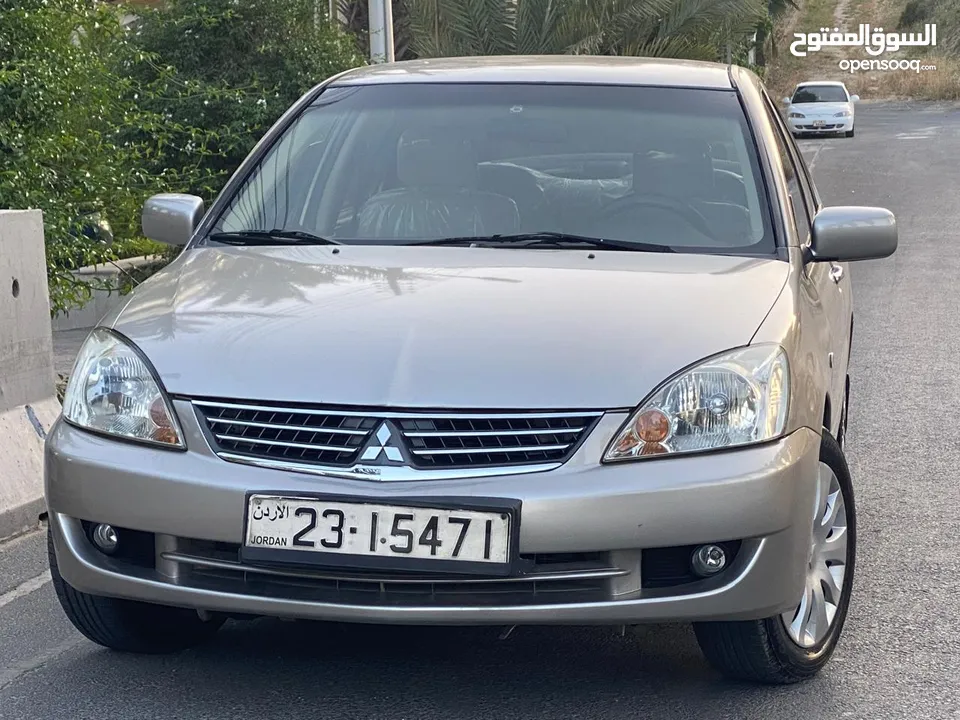 ميتسوبيشي لانسر  موديل 2011 GLX ماتور 1600  اصلي وارد الكويت بختم الوكيل الملا الاصلي. فحص كامل