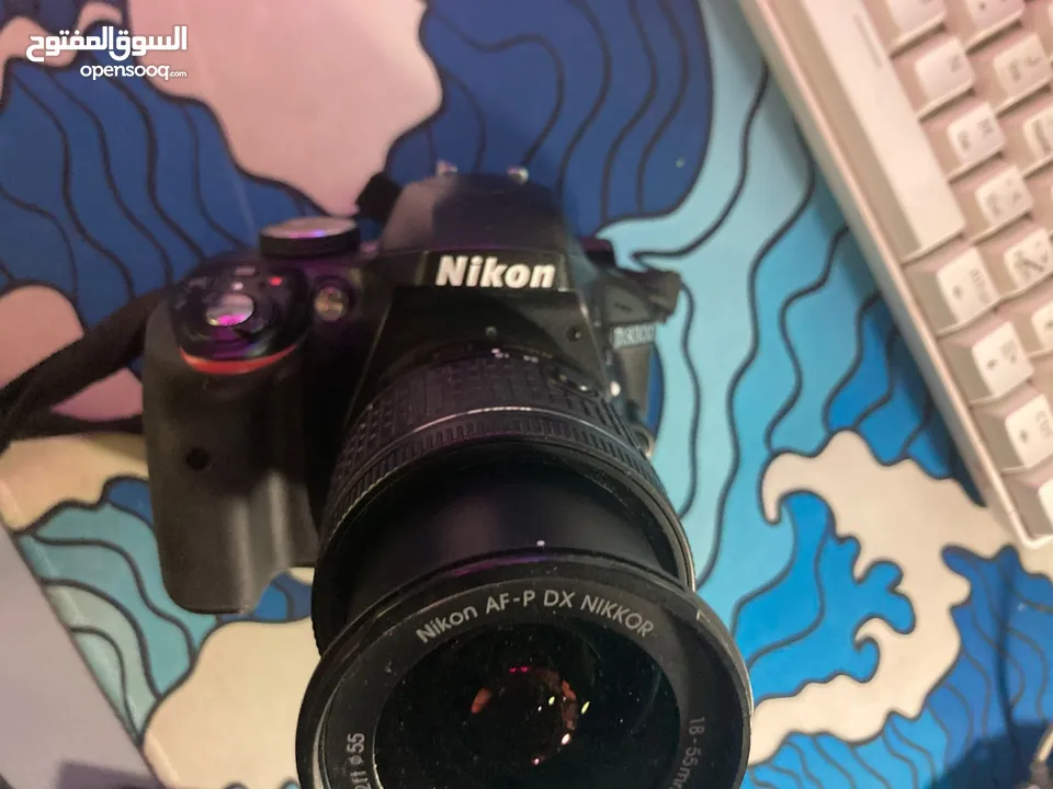 نيكون 3300d حال الوكاله  شتر قليل  عدسه 18/55 ستراب  وصلات  ترايبود  شاحن  بطاريه