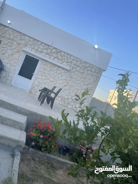 ارض دونم مع بيت ارضي وبيت طابقين