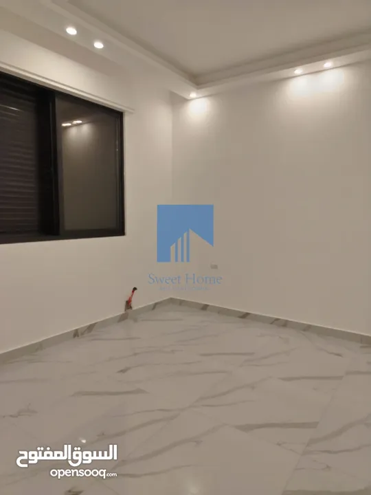 شقة أرضية فاخرة للبيع في خلدا - قرب إشارة البنك العربي 145م مع حديقة وترسات 120م لم تسكن