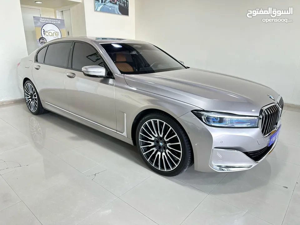 بي ام دبليو  750Li XDrive ذهبي داخل زعفراني خليجي