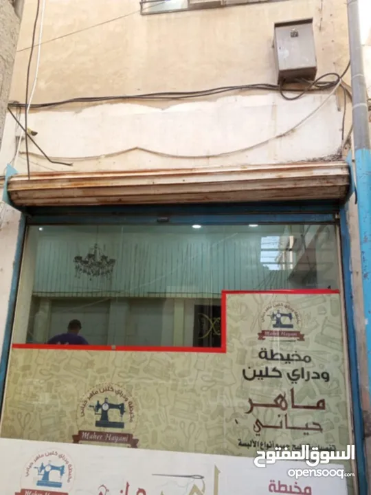 عمارة وسط السوق التجاري بين شارع السعادة وشارع الملك عبدالله