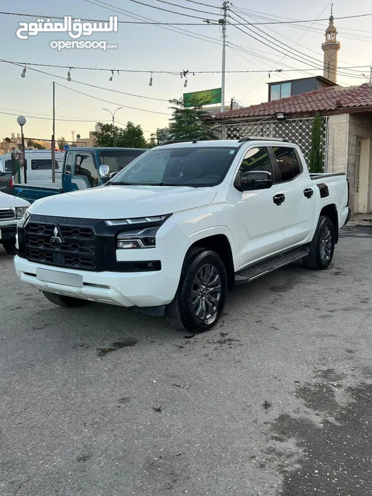 ميتسوبيشي L200 2024 فحص كامل ممشى قليل 44 جلد ودفلك مثبت سرعه اعلى صنف لون لؤلؤى