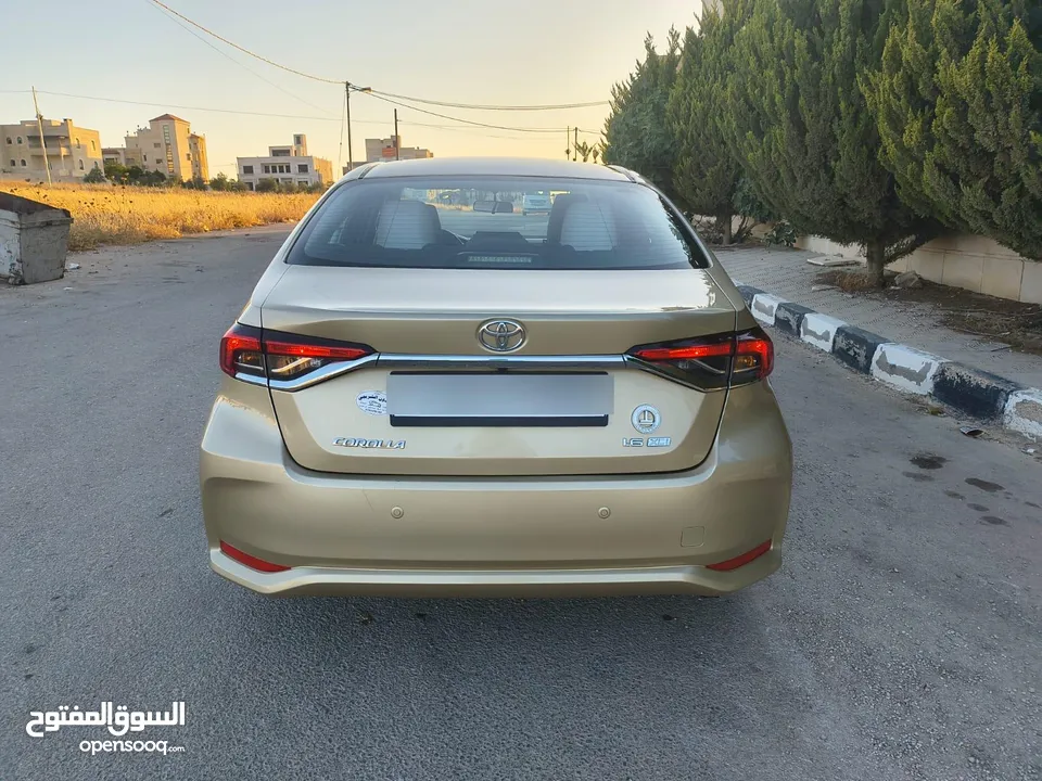 تويوتا كورولا 2021 لون شمباني بنزين اصلي ماتور cc1600 فحص كامل جمرك حديث