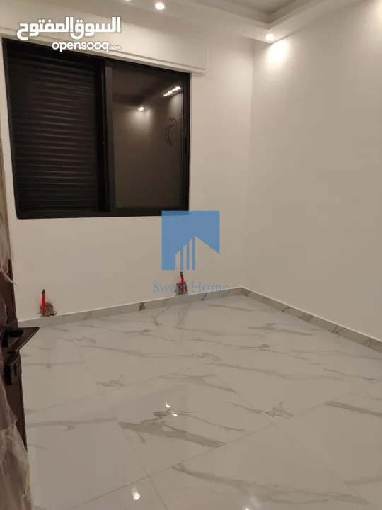 شقة أرضية فاخرة للبيع في خلدا - قرب إشارة البنك العربي 145م مع حديقة وترسات 120م لم تسكن