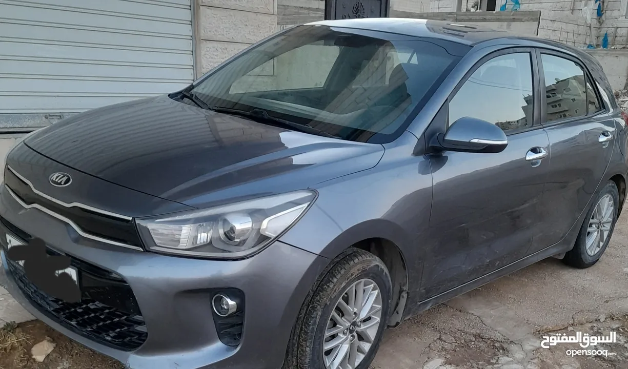 كيا ريو رمادي اصل شركة 2019  للبيع  ماشية 65 فقط