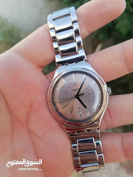 #SWATCH  سواتش سويسري اصلي لومينوس شباك للتاريخ  حجم 41 بحالة ممتازه  40 دينار