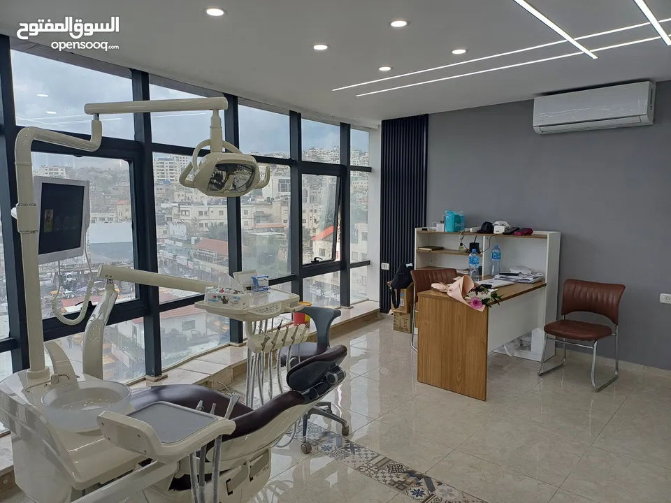 زراعة وتجميل الاسنان في جنين مركز د. اسامة عواد -برج الساعة ط4