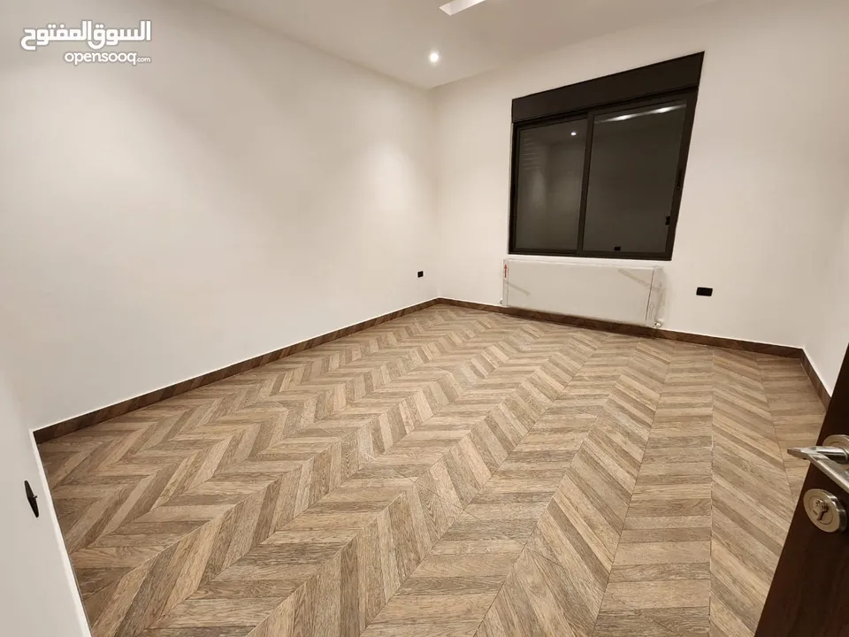 شقة مع روف دوبلكس للبيع على طريق المطار ( البنيات )  ref : 14367
