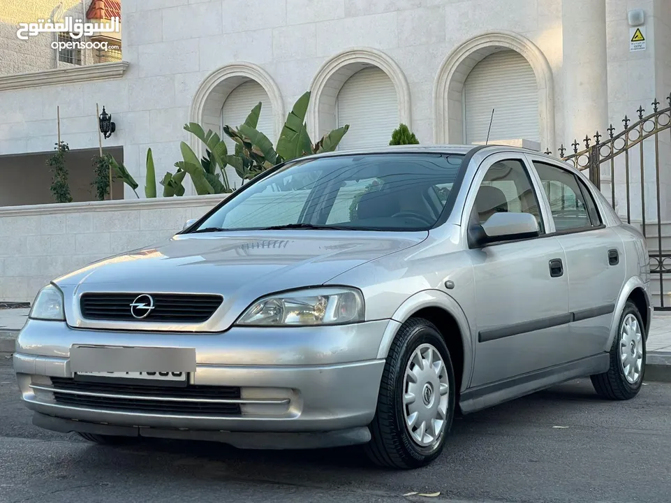 ‎أوبل استرا موديل 2001  وارد الوكالة ومالك واحد فقط من الشركة عداد 100الف كيلو فقط