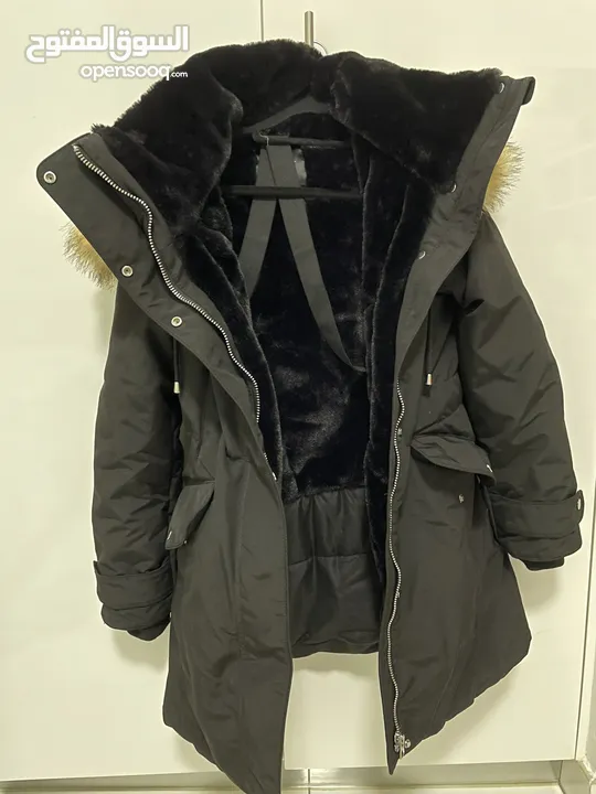 New Zara Black Winter Jacket with faux fur lined hood. Adjustable size waist and wrist