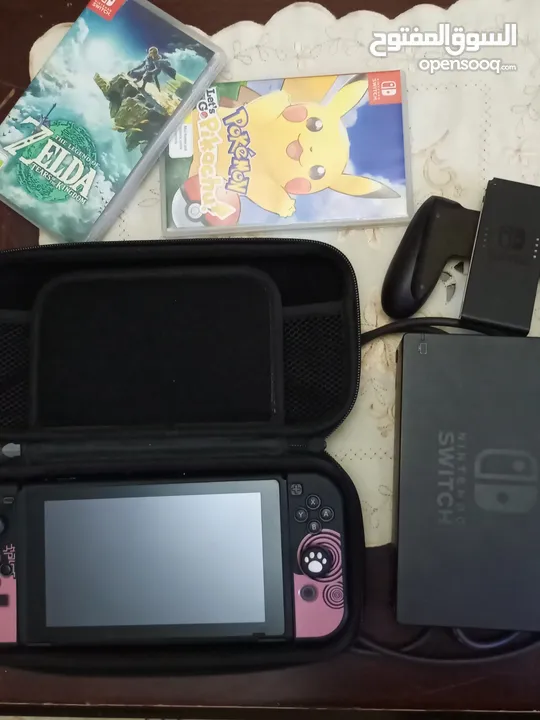 نينتندو سويتش OLED (مستعمل كالجديد) + لعبتين nintendo switch oled