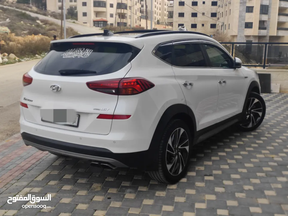 هونداي توسان فل الفل اضافات دهان شركة وعداد أصلي 70000كم فقططط رخصة وتأمين شامل للبيع بسعر مغري