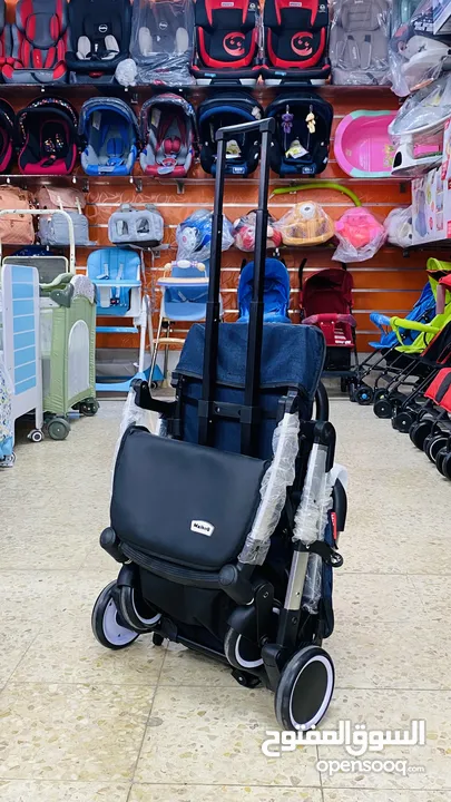 عرباية السفر من island toys ماركة NE الروسية  مع امكانية التحويل ل حقيبة يد للحمل