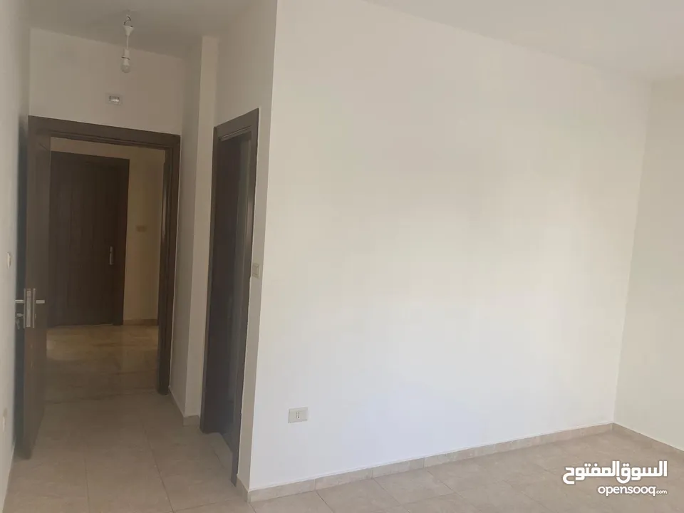 شقه فارغه ارضيه للايجار في دير غبار - REF : 14534