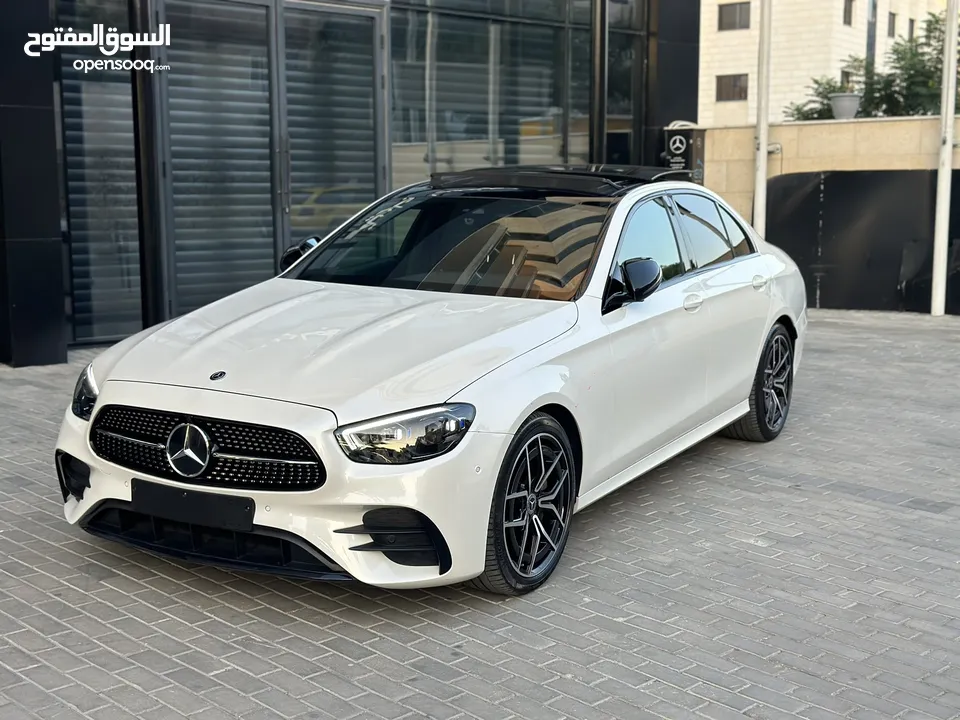 Mercedes E220 AMG package2021  عداد قليل ولا حرام بويه لون مميز ابيض لولو  amg اصلي من الداخل والخار