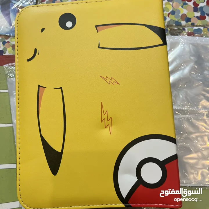 كروت بوكيمون والبومات (Pokemon cards and binders)