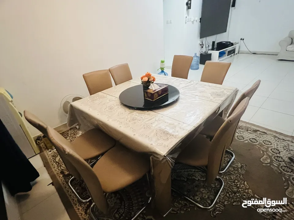 Used 8 seater glass dining table with chairs for sale