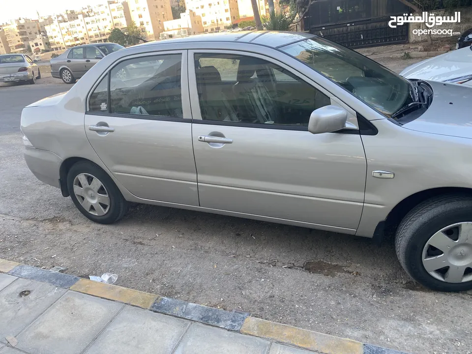 ميتسوبيشي لانسر موديل 2010 محرك 1300 سي سي ..الفحص مرفق بالصور