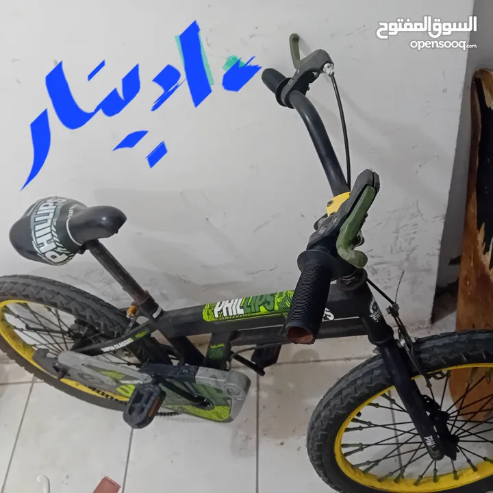 دراجة هوائية وعربانة اطفال