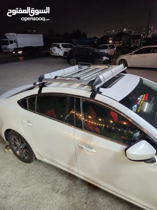 Universal roof rack/carrier with basket
