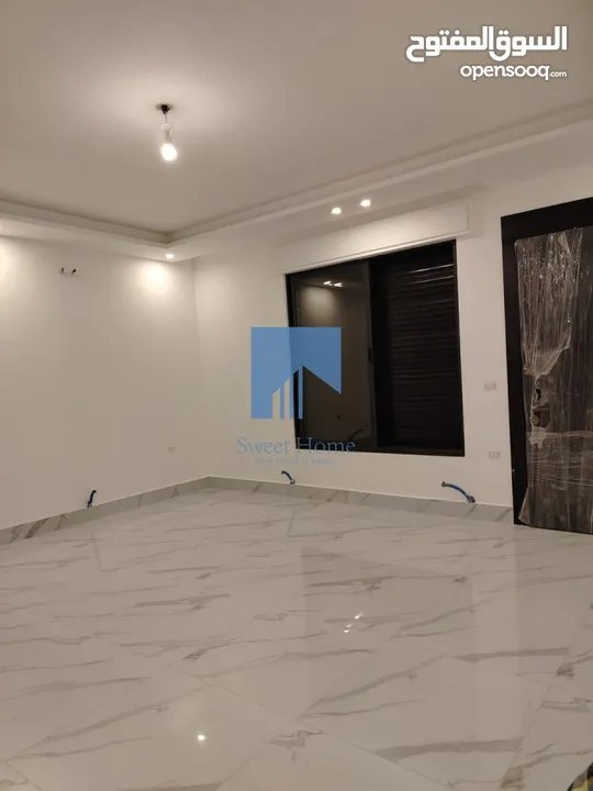 شقة أرضية فاخرة للبيع في خلدا - قرب إشارة البنك العربي 145م مع حديقة وترسات 120م لم تسكن
