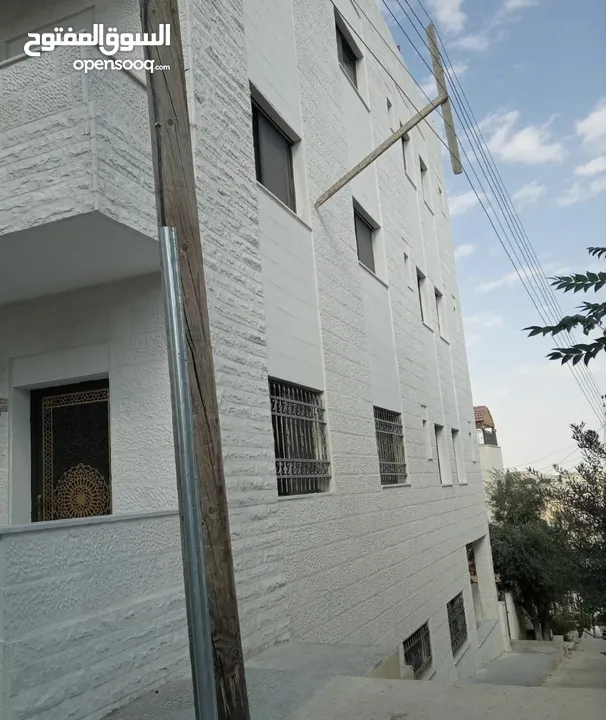 عماره جديده/4 شقق طابقيه للبيع