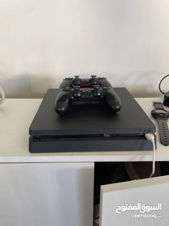 PlayStation 4 slim with GTA, FC24, and fifa 23 comes with 2 controllers and charger