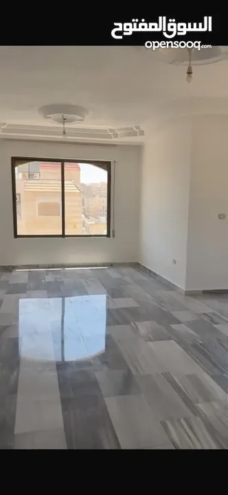 Excellent natural light and winds with views of Shafa Badran from the highest level in the building.