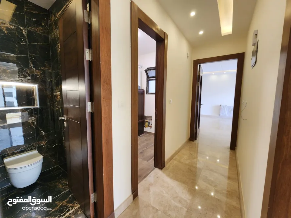 شقة طابقية للبيع في حي الصحابة - ref : 14579