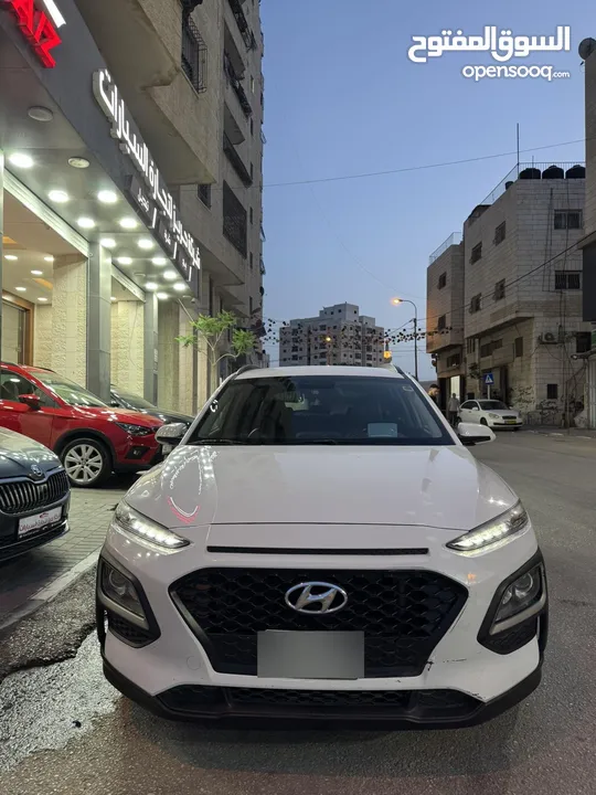 هونداي كونا 2018 لون ابيض فحص ممتاز تشغيل بصمه شاشه كبيره كاميرا خلفيه فرش جلد حساسات جنط مغنيسيوم