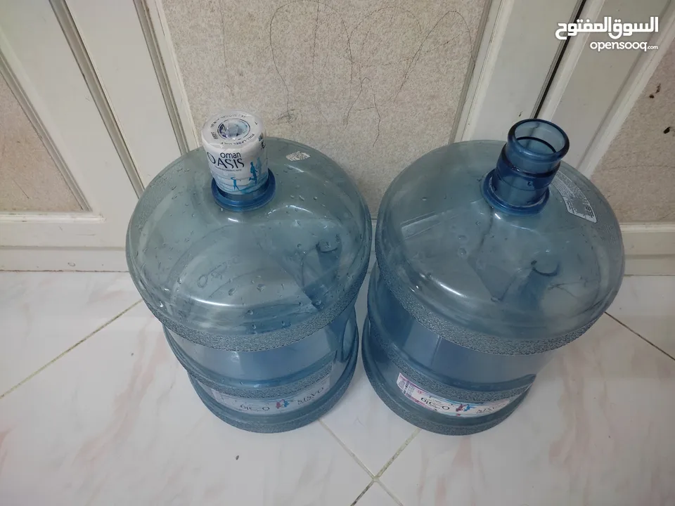 2  empty OASIS water bottle  sale in Alkhoud. Each bottle RO 2.