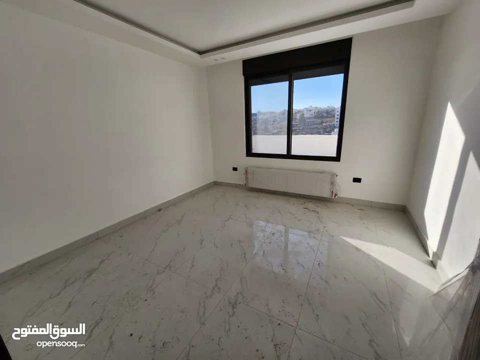شقة مع روف دوبلكس للبيع على طريق المطار ( البنيات )  ref : 14367