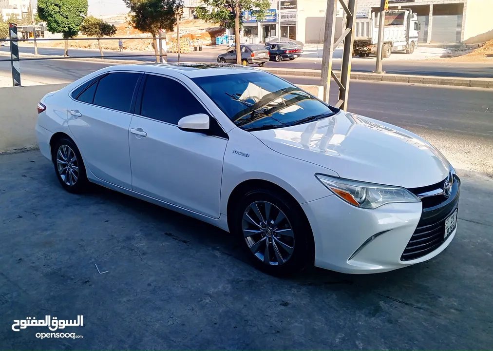 تويوتا كامري هايبرد موديل 2015 فحص كامل أعلى صنف بالاضافات XLE بحالة الوكالة.