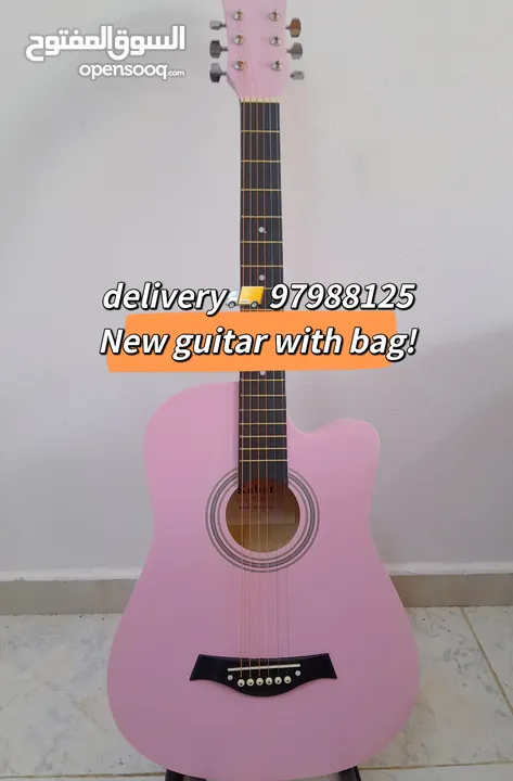 New acoustic guitar, with bag and picks, delivery