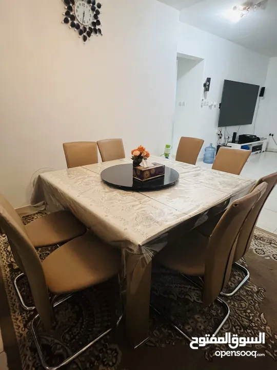 Used 8 seater glass dining table with chairs for sale