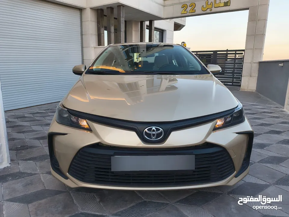 تويوتا كورولا 2021 لون شمباني بنزين اصلي ماتور cc1600 فحص كامل جمرك حديث