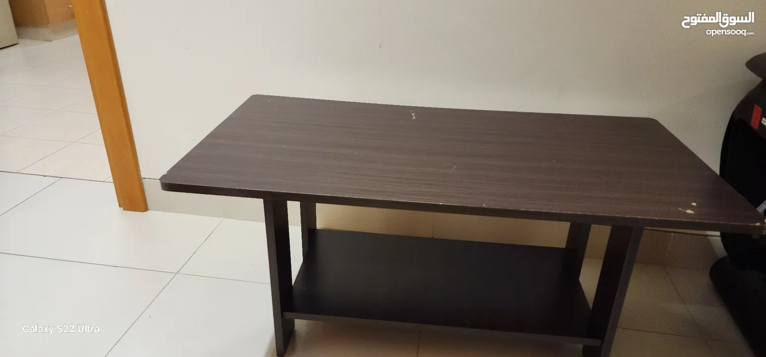 single bed frame and centre table