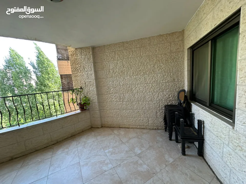 شقة للبيع - عين منجد - وحيدة بطابقها - 170م - بالقرب من سوبرماركت بغداد