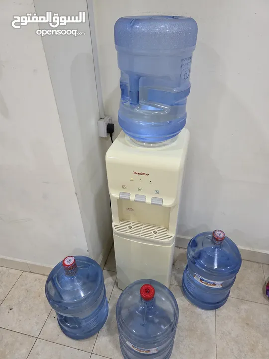 Water dispenser with 4 Almanhal/Nestle water bottles-30 BD